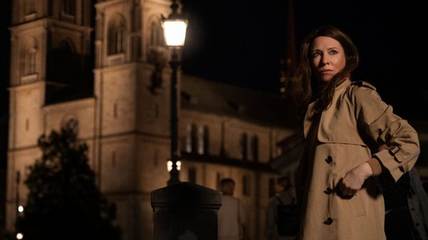 Black Bag film image; woman in trench coat walking at night