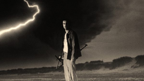 The Peril at Pincer Point film image; man standing in a lightning storm