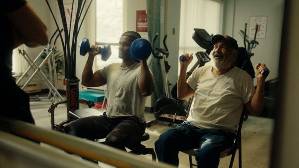 Strong Son film image; two men lifting weights
