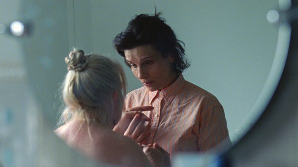 Queen at Sea film image; reflection in a mirror of two women talking