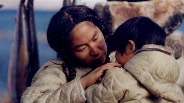 Atanarjuat film image; two people hugging