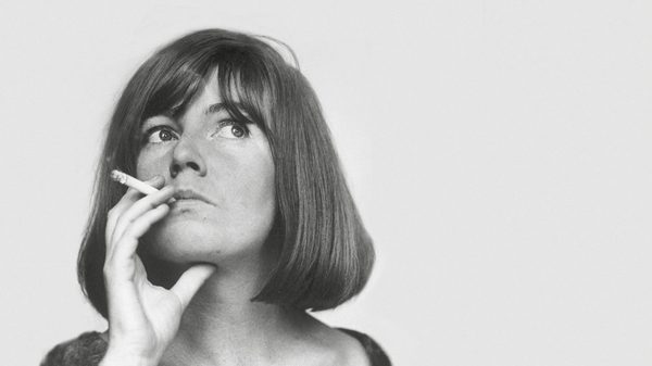 Blue Road film image; woman holding a cigarette to her mouth