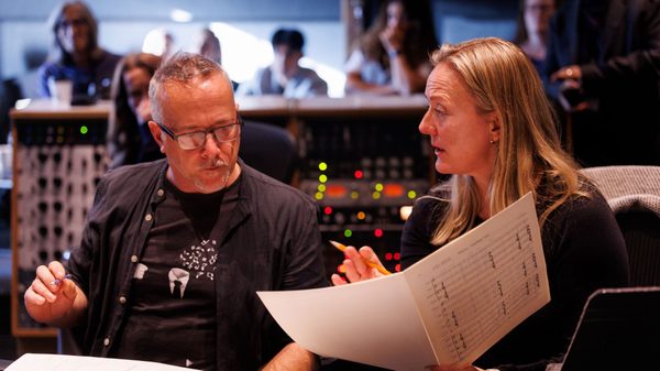 people working together in a sound booth