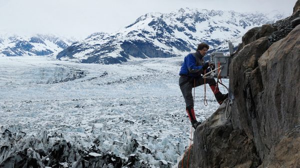 Chasing Ice film image; man scaling a snowy rockface