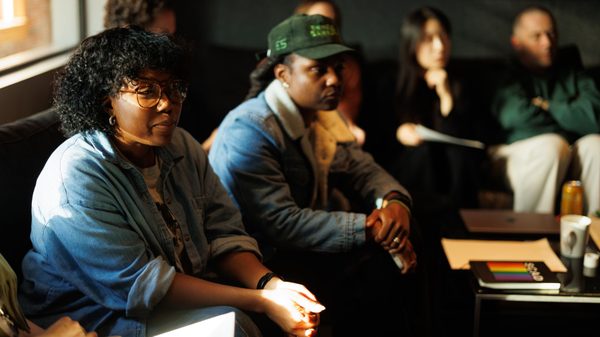 people listening to a speaker