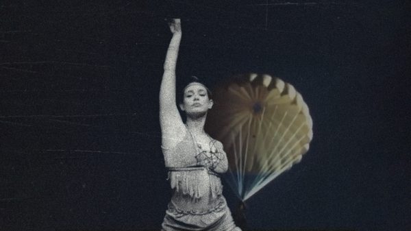 woman holding her hand in the air