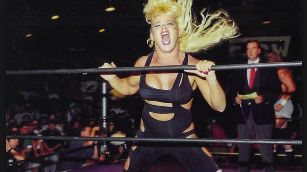 Lunatic film image; female wrestler screaming by a wrestling ring
