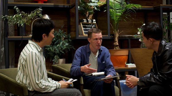 three people in a deep discussion