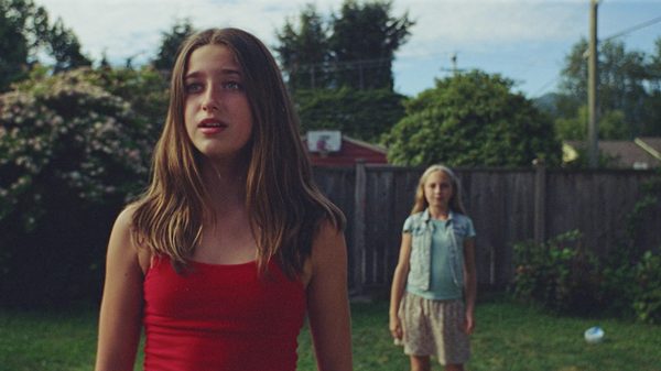 Broken Bunny film image; two girls standing in a yard