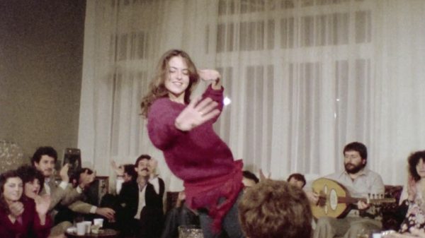 Do You Love Me film image; woman dancing in a crowd