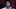 EPiC: Elvis Presley in Concert film image; close on man singing into a microphone