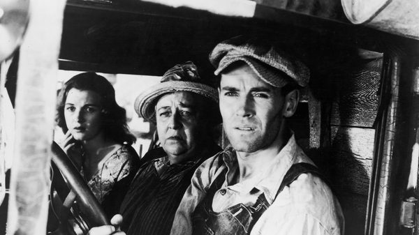 The Grapes of Wrath film image; three people in a car squinting at something
