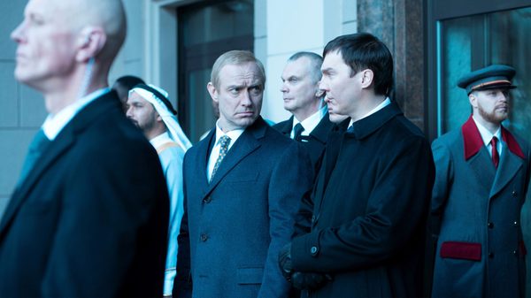 The Wizard of the Kremlin film image; group of serious men standing outside