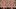 Being John Malkovich film image; big crowd of people holding up masks of one man's face