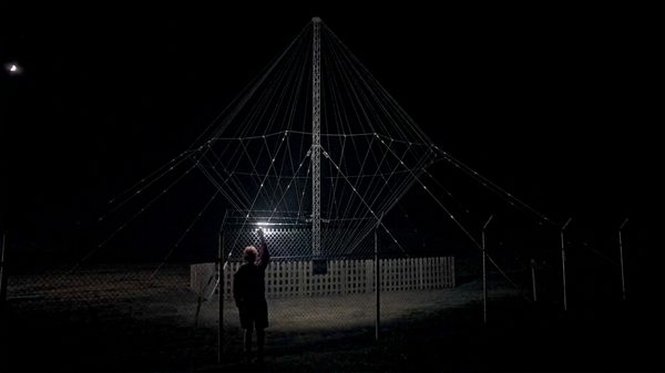 The End of the Internet film image; man holding a light up in the dark