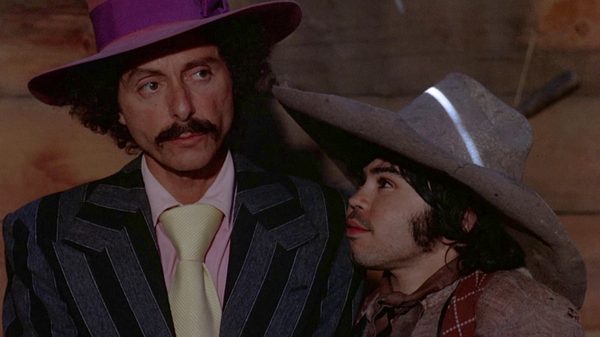 Greaser's Palace film image; two people in large hats