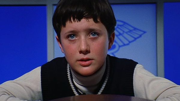 Magnolia film image; concerned-looking person against a blue background