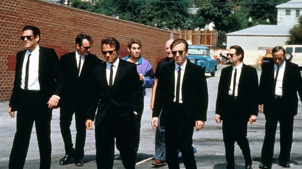 Reservoir Dogs film image; group of men in suits walking down a street
