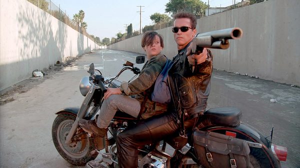 Terminator 2 film image; boy and man on a motorcycle