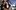 Titanic film image; man and woman in a loving embrace on the bow of ship