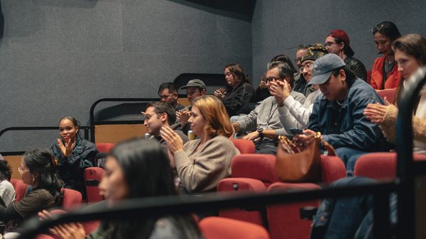 people applauding in an audience