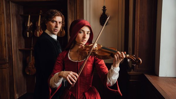 Vivaldi and Me film image; man watching a woman play the violin