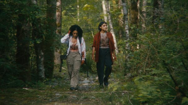 A Safe Distance film image; two people walking through the woods