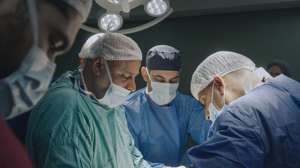 American Doctor film image; doctors in an operating room