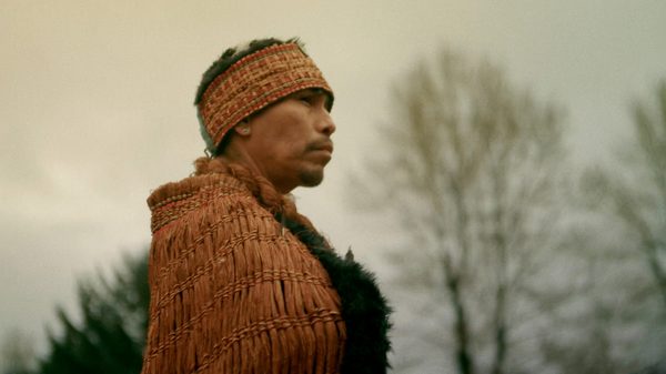 Ceremony film image; person in traditional Indigenous clothing