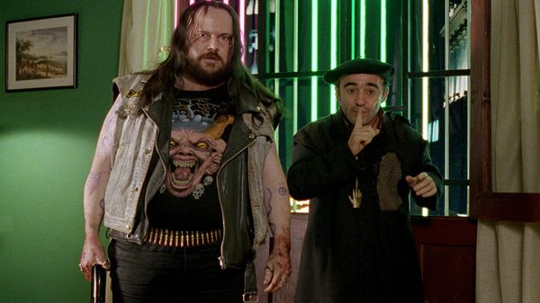 The Day of the Beast film image; two people standing in a green-painted room