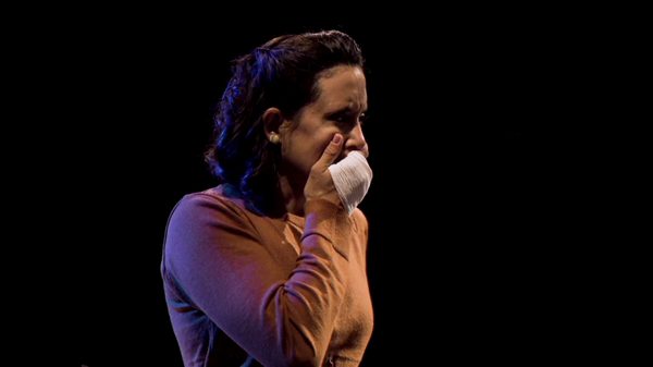 Family Fears Another Night of Terror film image; woman pressing her hand to her mouth