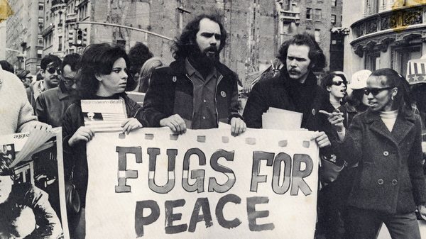 Fugs Film! film image; people holding up a protest sign