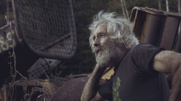 Green Valley film image; man looking into the distance