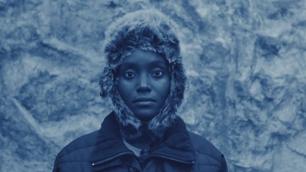 Heat film image; woman in a snowy environment and a fur hood pulled over her head