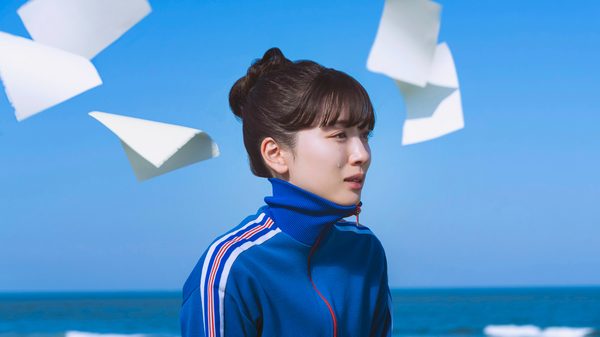KAKU KAKU SHIKA JIKA fka Blank Canvas; woman with sheets of paper flying around her