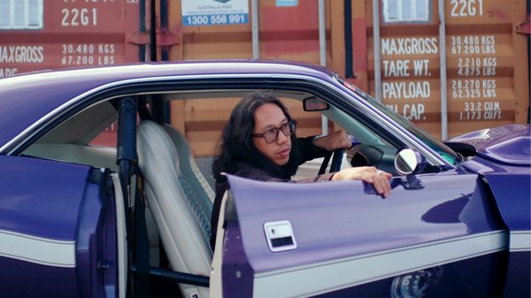 man getting out of a car