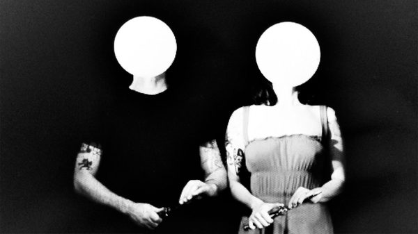 two people with blank circles for heads