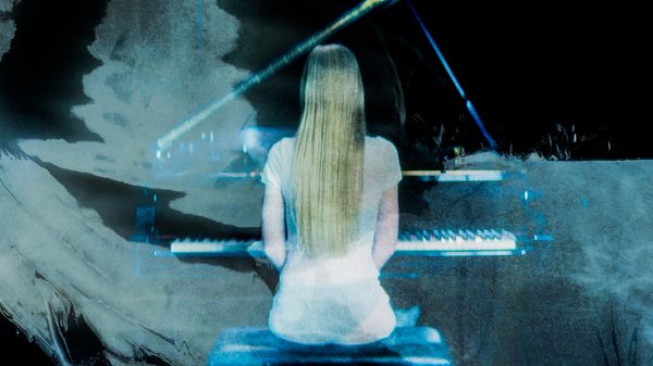 woman playing a piano