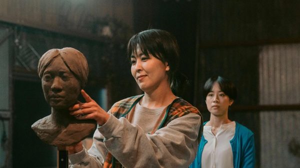 Nagi Notes film image; woman working on a clay bust