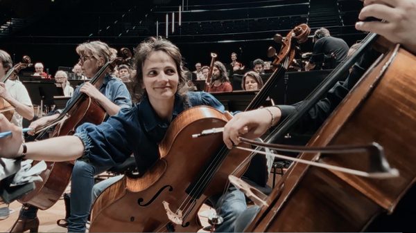 Nous, L'orchestre De Paris film image; people playing cellos