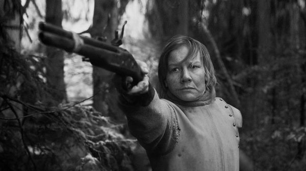 Rose film image; woman pointing gun