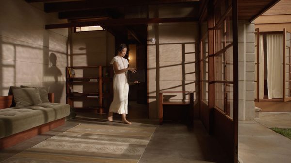 Schindler Space Architect film image; woman carrying file