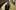 The Secrets in Their Eyes film image; two people talking in a crowded train station