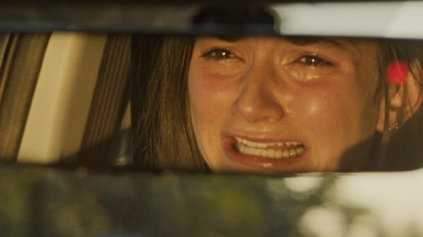 Ugly Cry film image; reflection in a rear-view mirror of a woman sobbing
