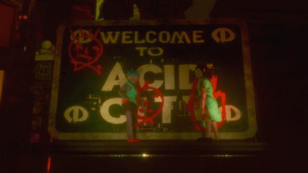 Acid City film image; street sign covered in graffiti
