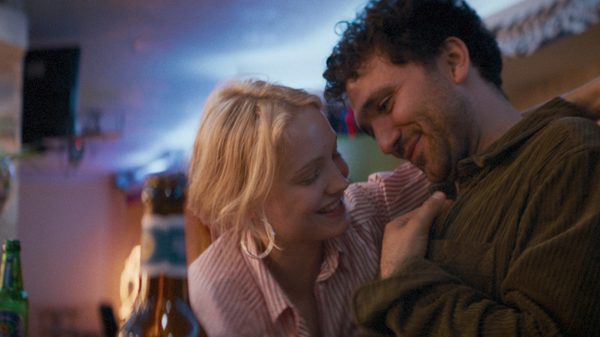 The Ballad of Wednesday to Thursday film image; man and woman laughing in an embrace