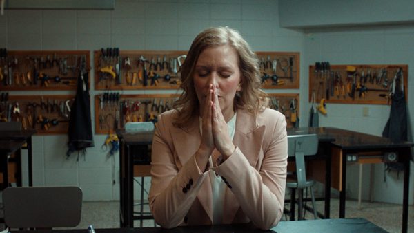 A Breath of Fresh Air film image; woman with her hands clasped together in prayer