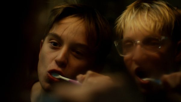 Buddies film image; two people brushing their teeth
