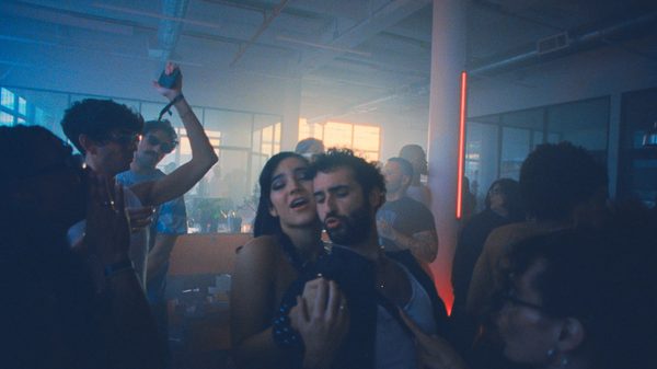 Club Kid film image; woman pressing herself against a man