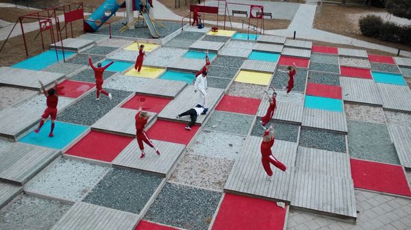 Concrete Kids film image; people dancing on large checker box flooring